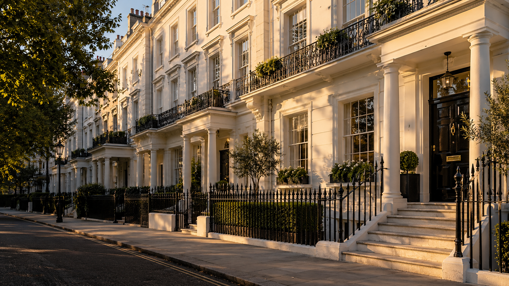 Elegant pale Georgian-style terraced homes in warm evening light