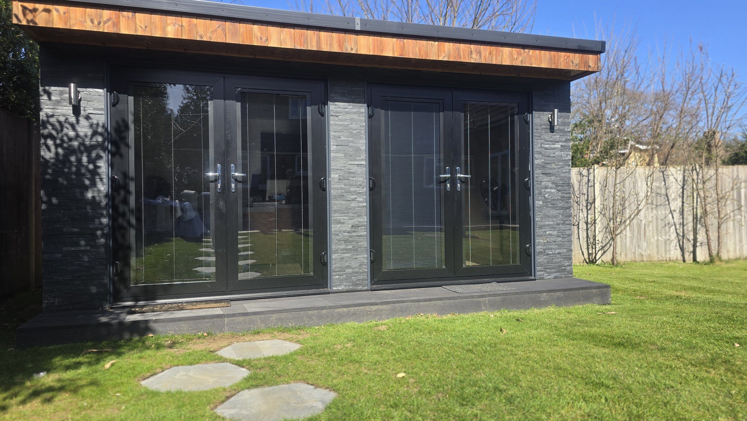 Completed decking step and walkway at garden office in Witley