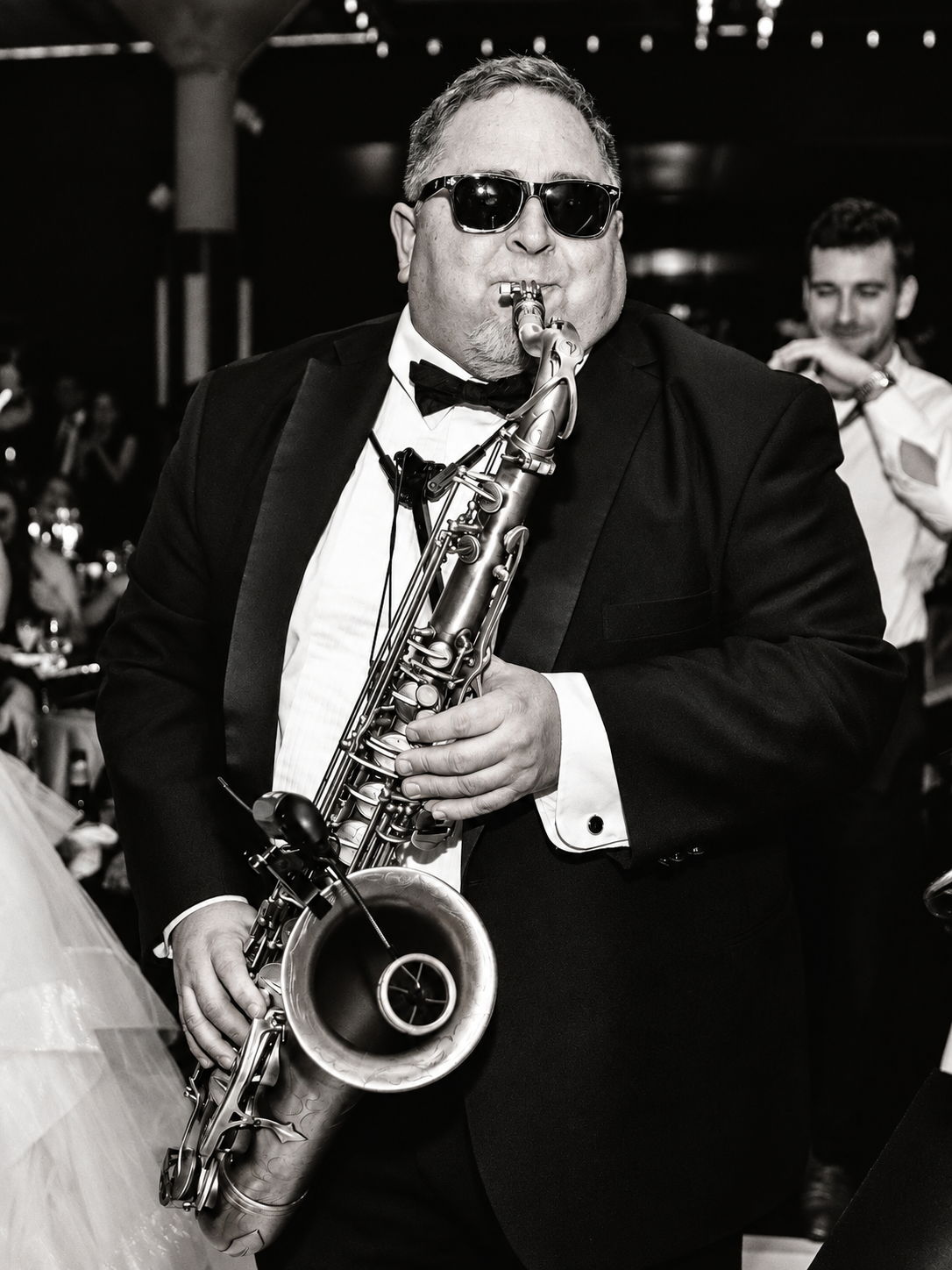 Steve Phillips playing saxophone at an event