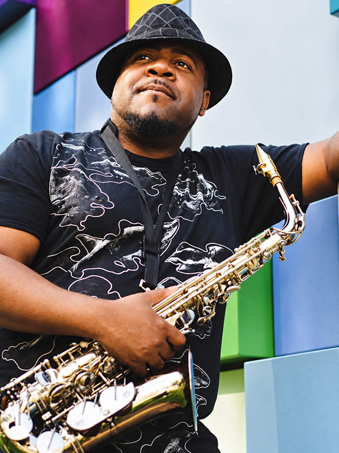 Wesly Walker holding a saxophone