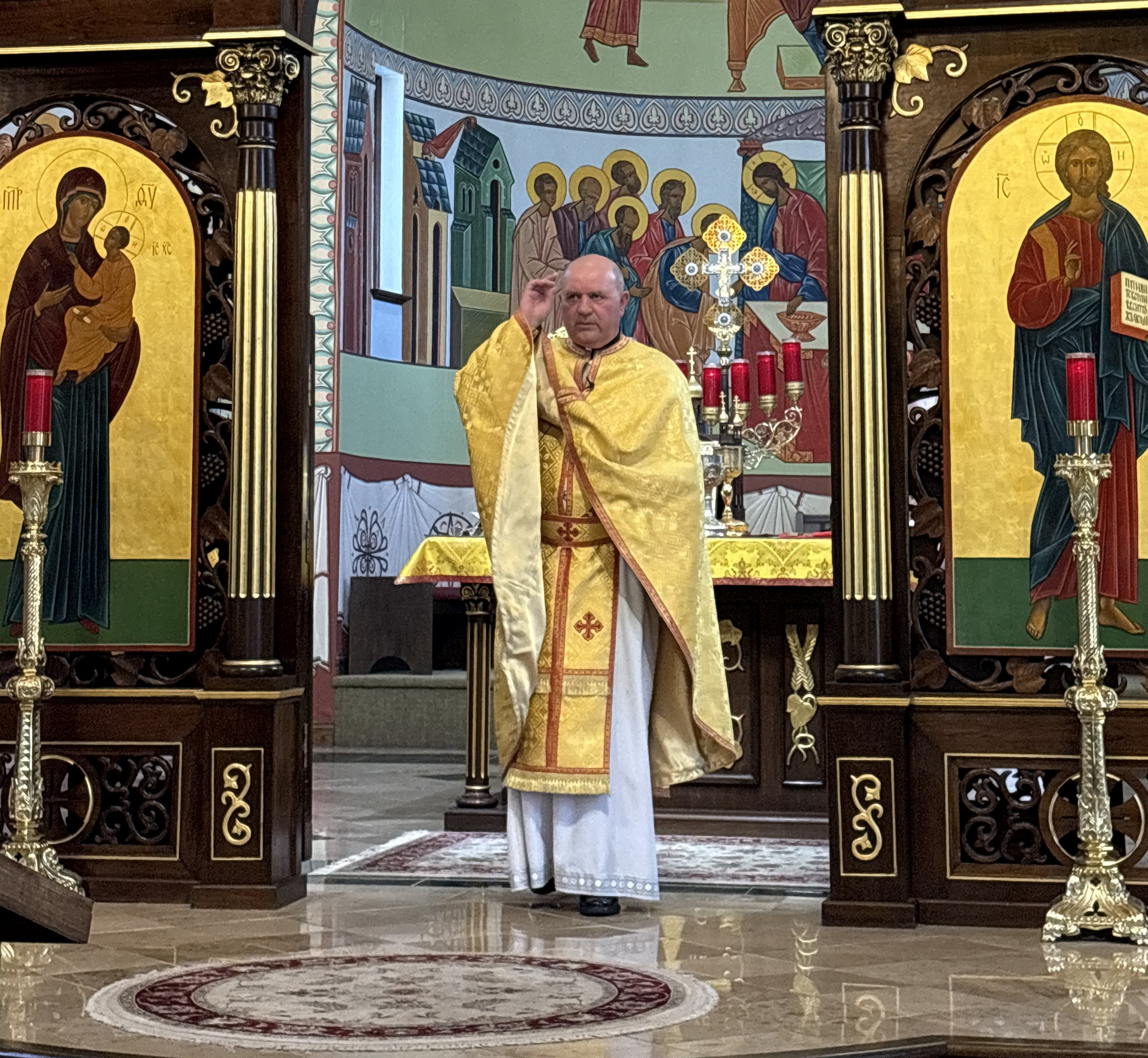 Priest holding his hand in blessing