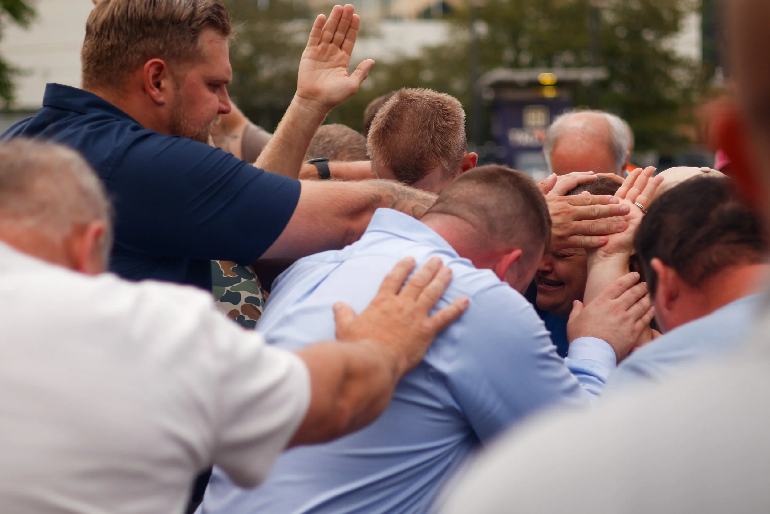 People worshiping with hands raised
