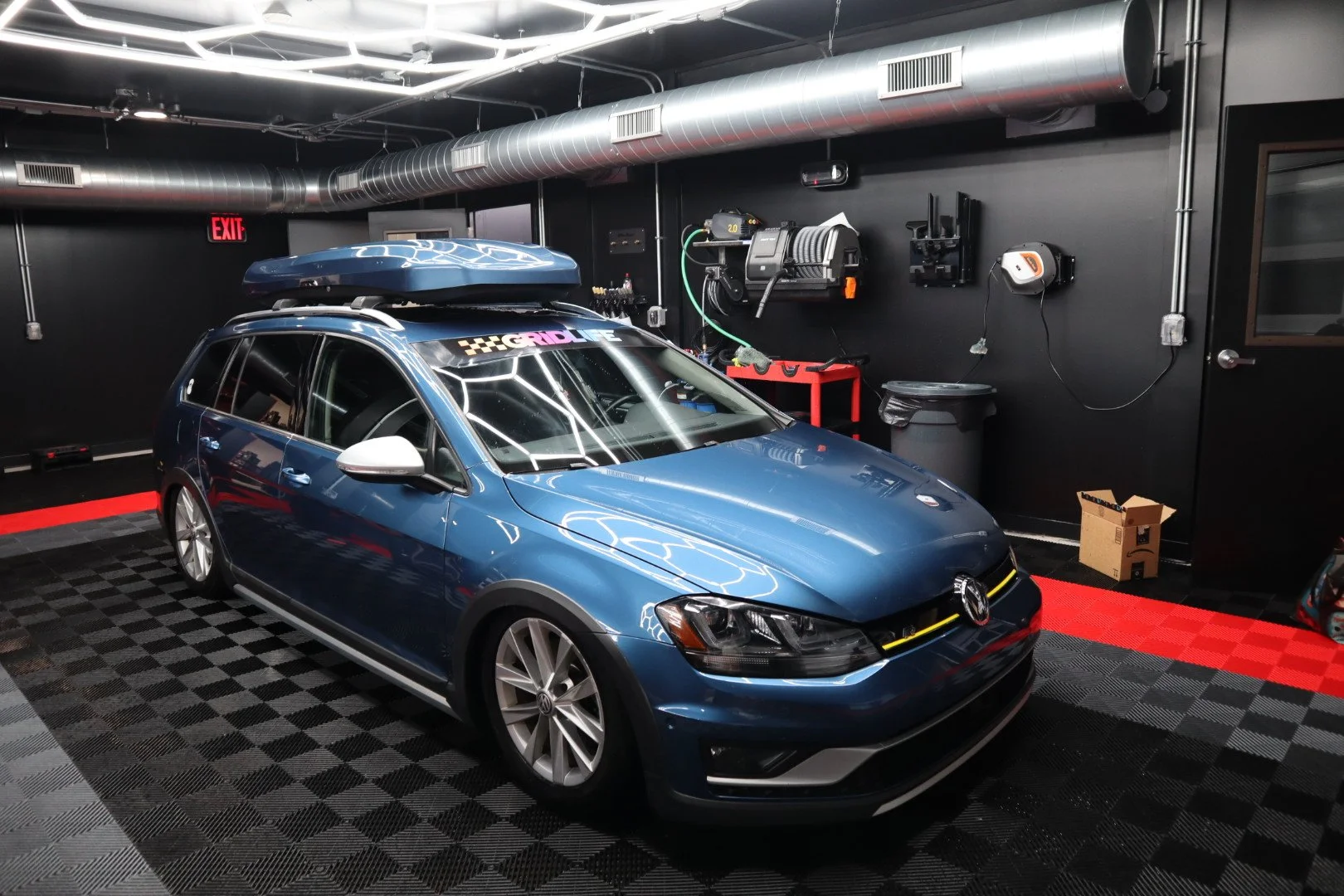 Blue Volkswagen wagon inside Mad River Detailing
