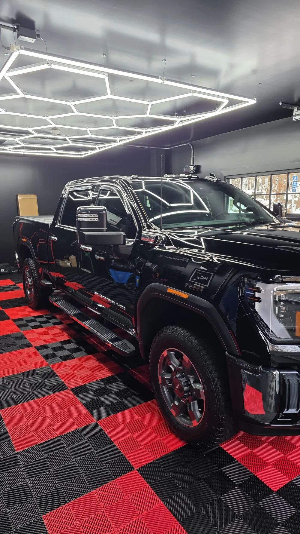 Black pickup truck in Mad River Detailing's Winsted shop