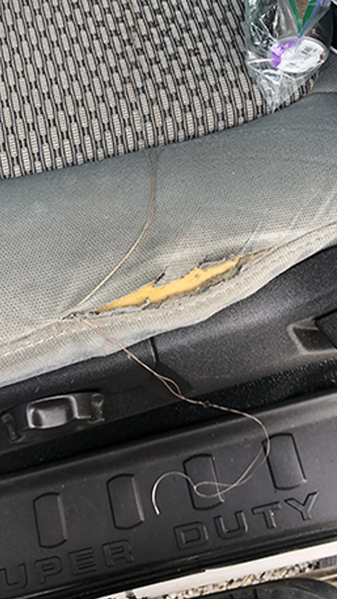 Before: Torn stitched seat upholstery