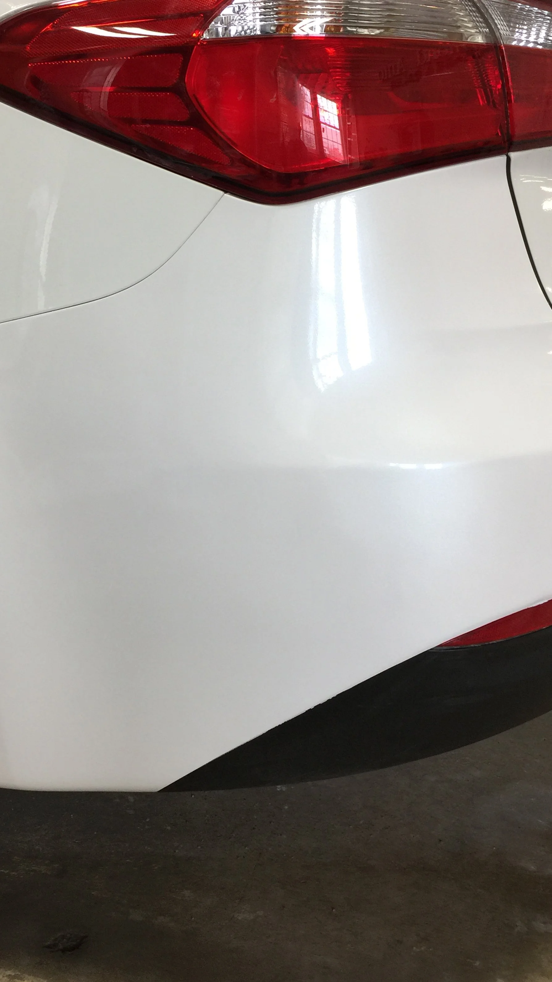 After: Rear bumper repaired and refinished