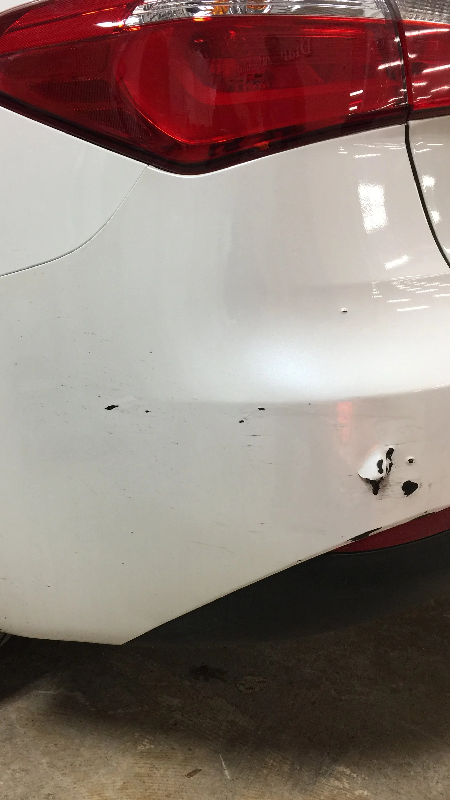 Before: Damaged rear bumper