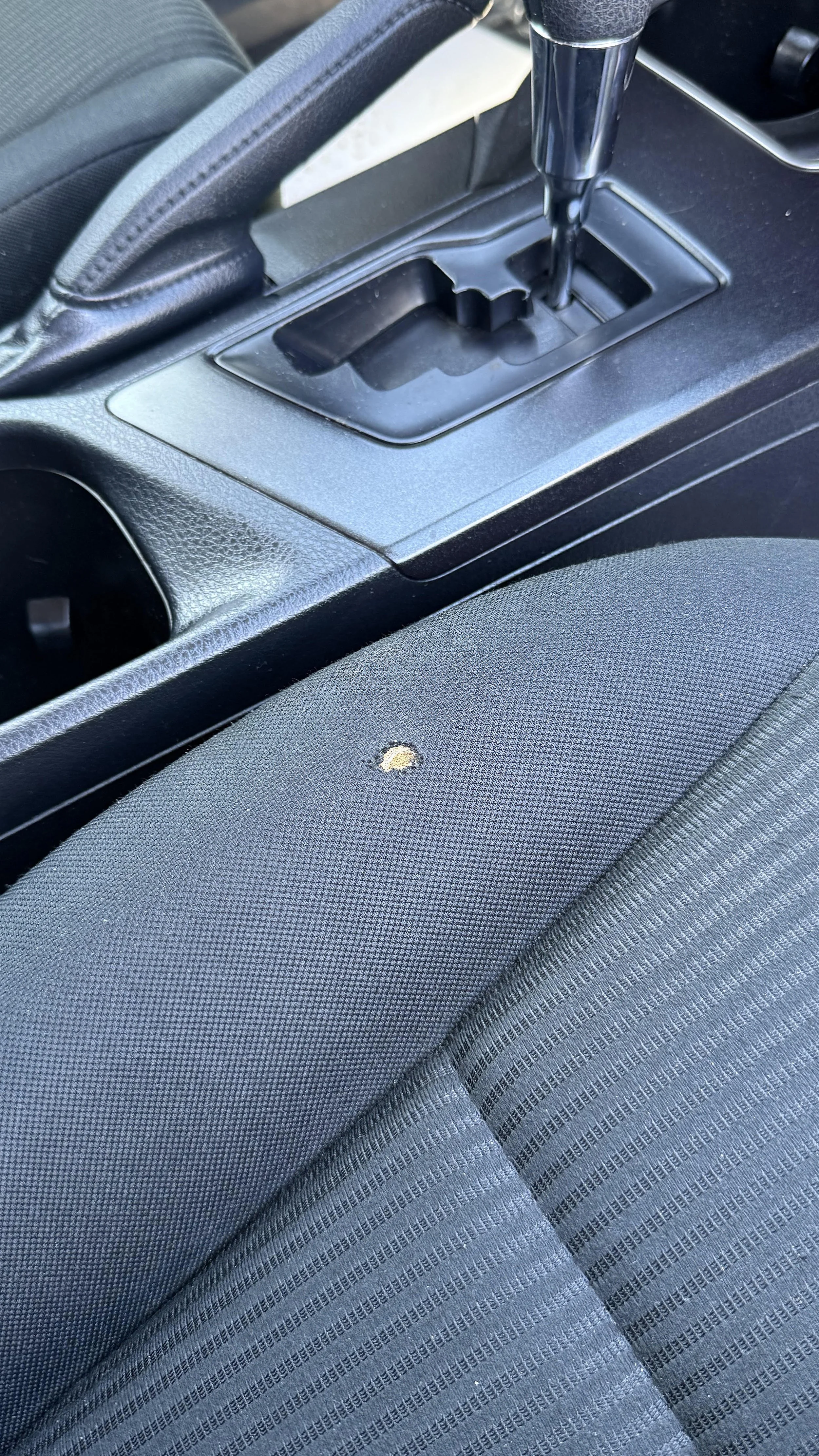 Before: Seat with a cigarette burn