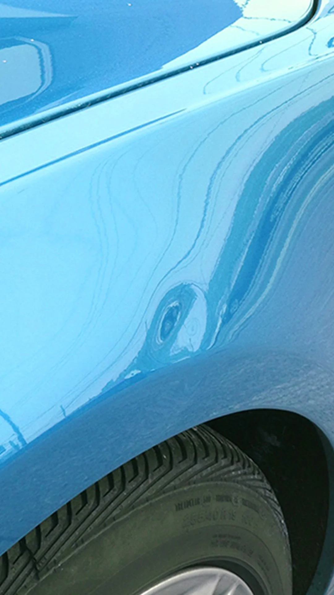 Before: Body panel with a dent