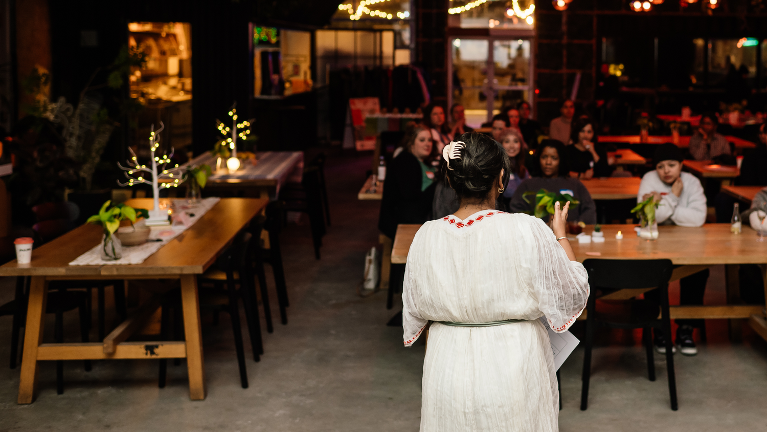 Mihret facilitating a full room at a Clear Space gathering