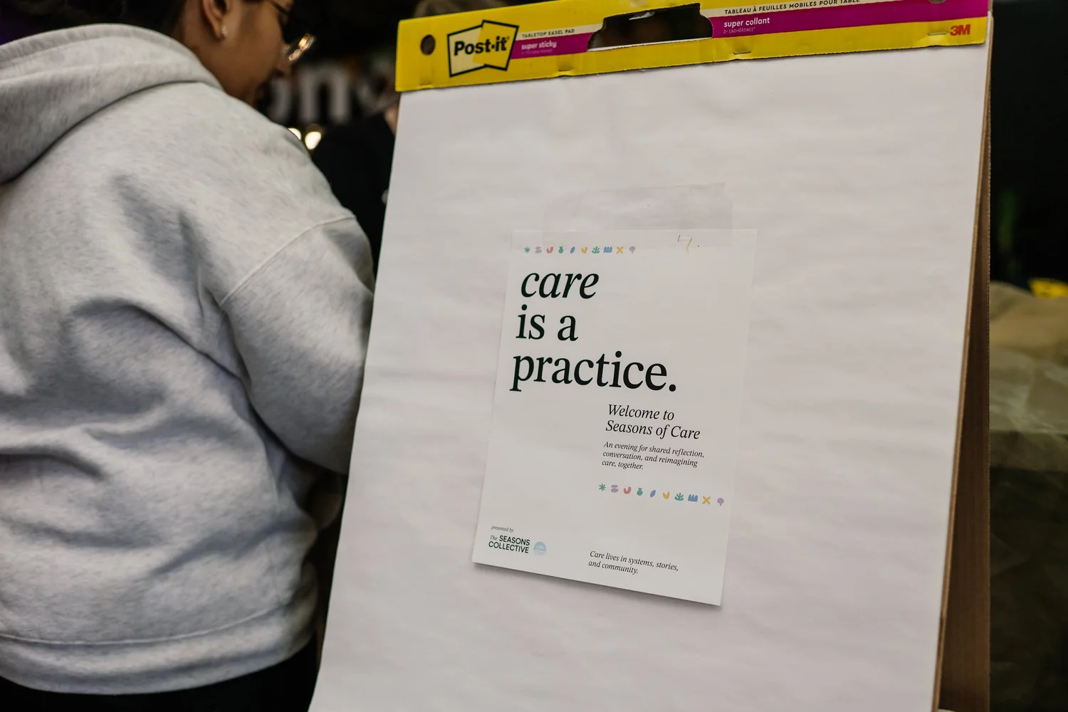 A card on a flip chart that reads: care is a practice