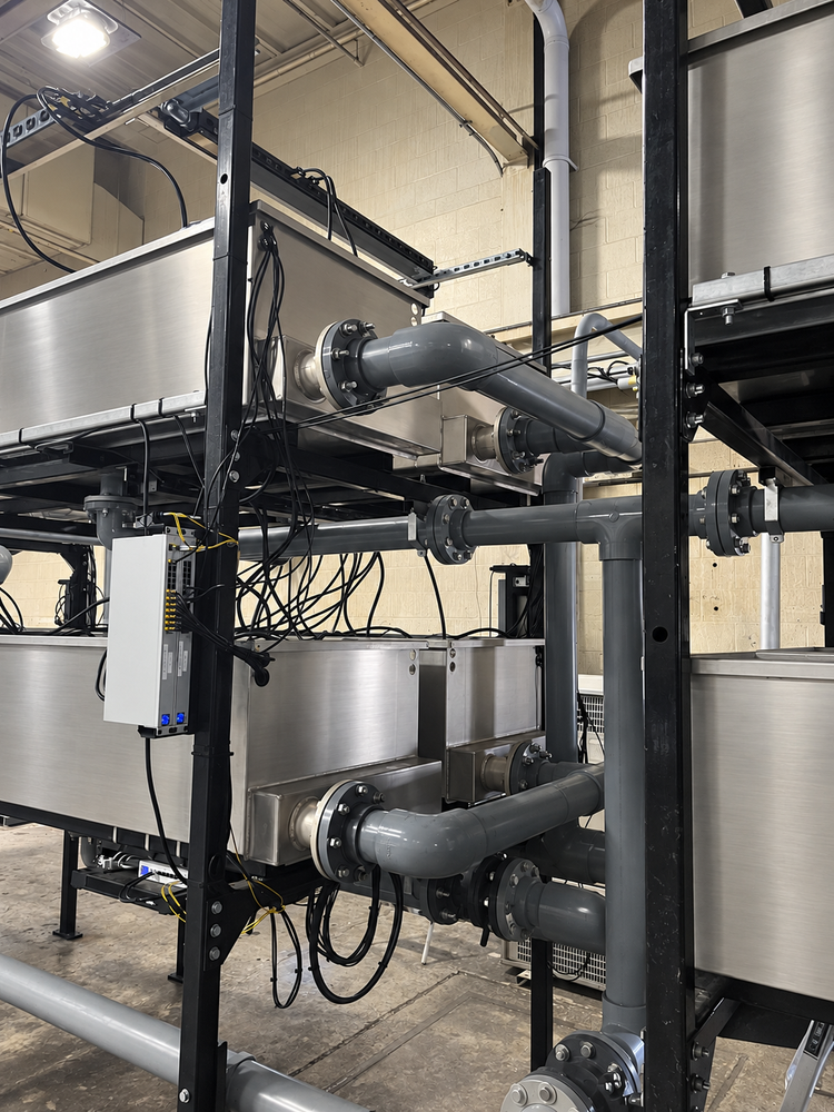 Tank connections and electrical wiring on the immersion racks