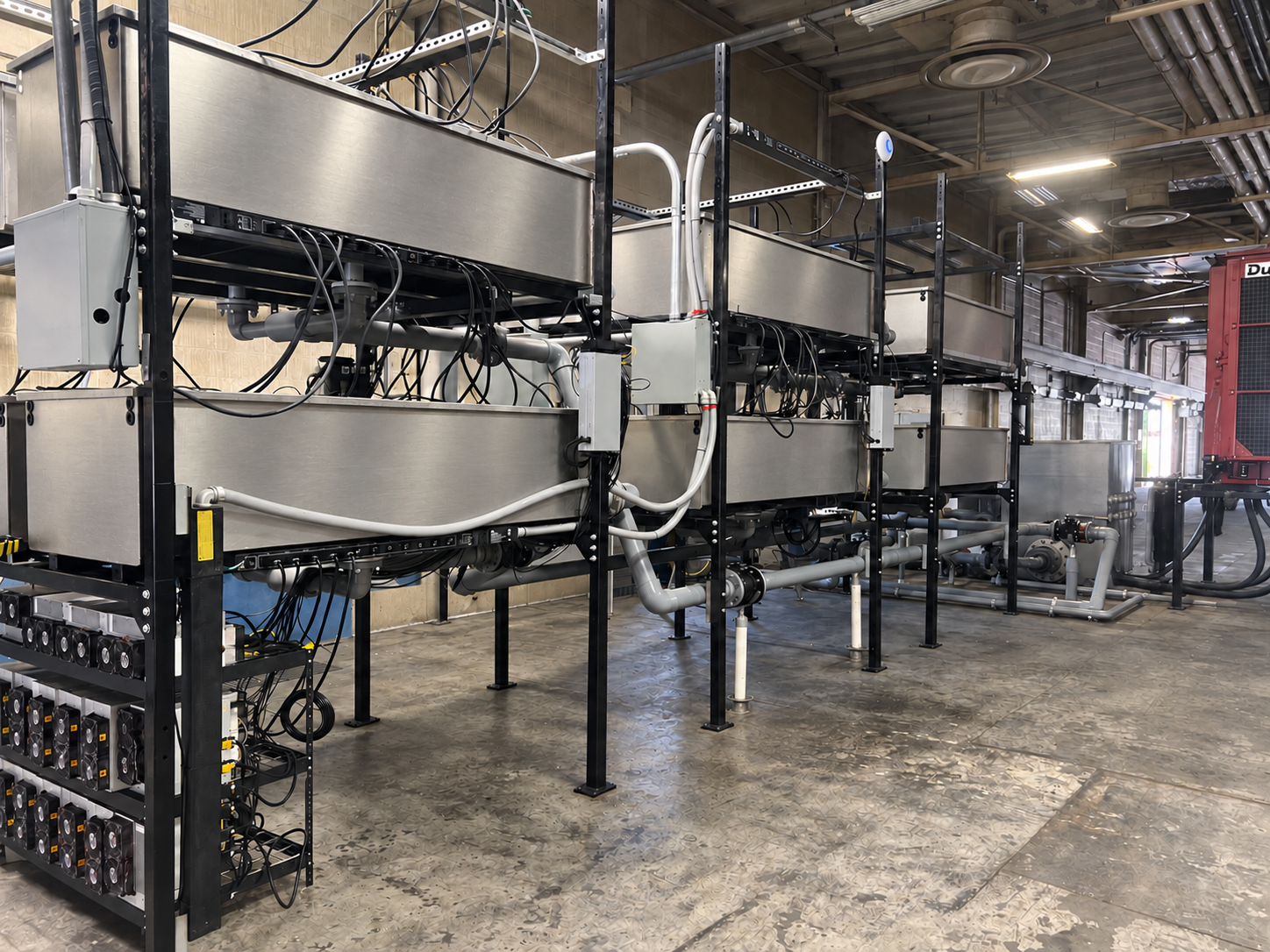 Immersion racks and cooling equipment inside the facility