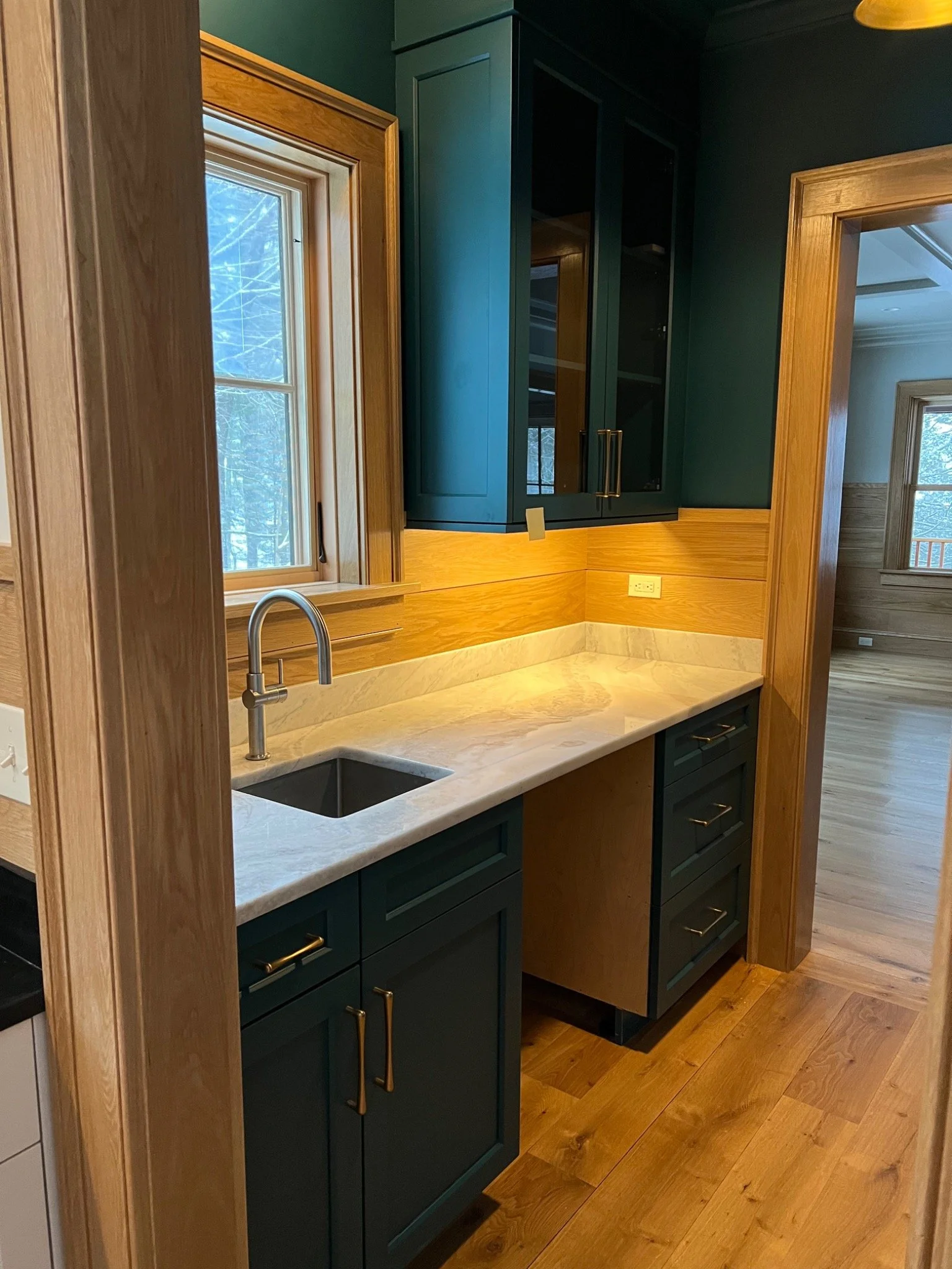Painted cabinetry, warm accents