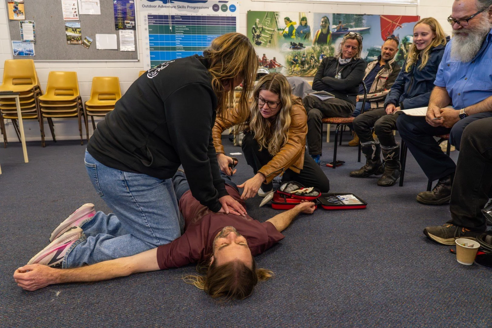 Group of participants learning first aid techniques, FAFM training across Australia