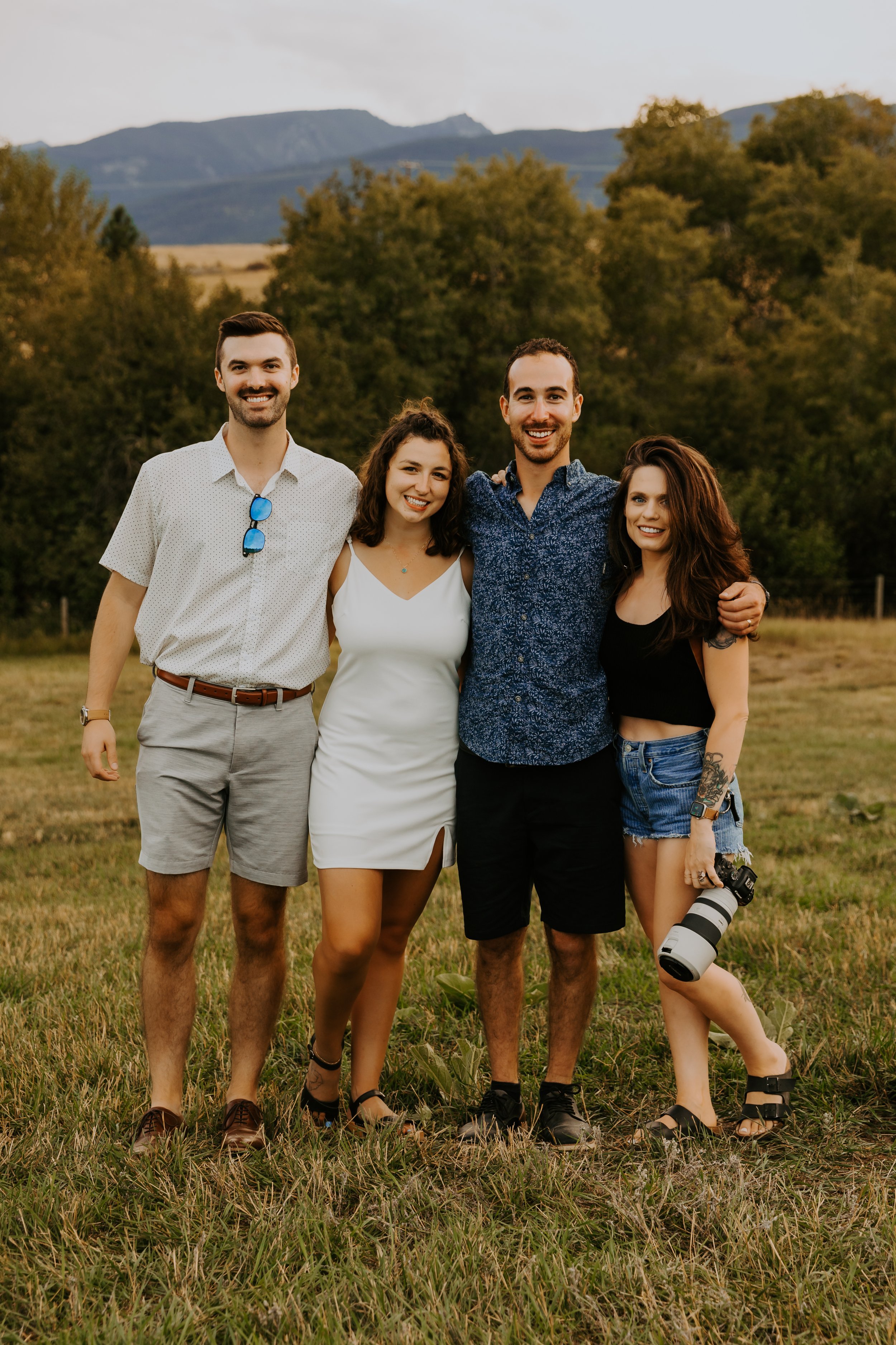 Aundrea photographing a couple in Glacier National Park