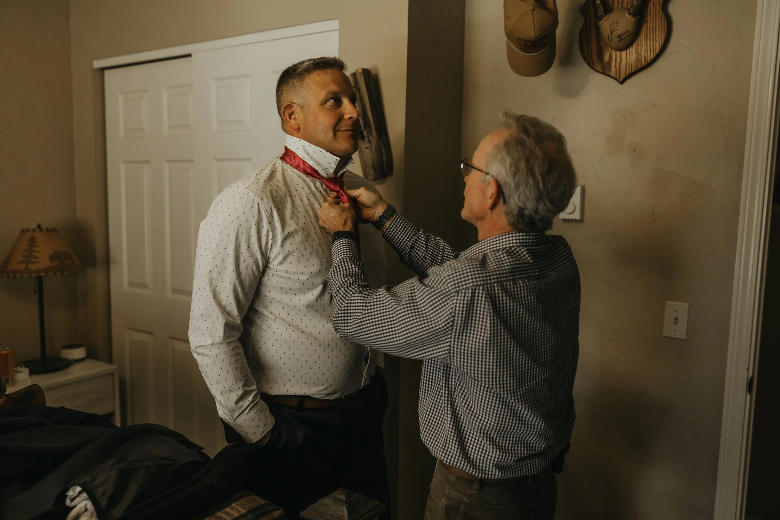 Getting ready at a Columbia Falls Airbnb before a Glacier National Park elopement