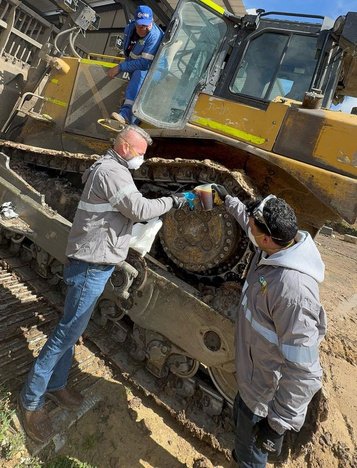Maintenance work on a Caterpillar bulldozer in the documented program