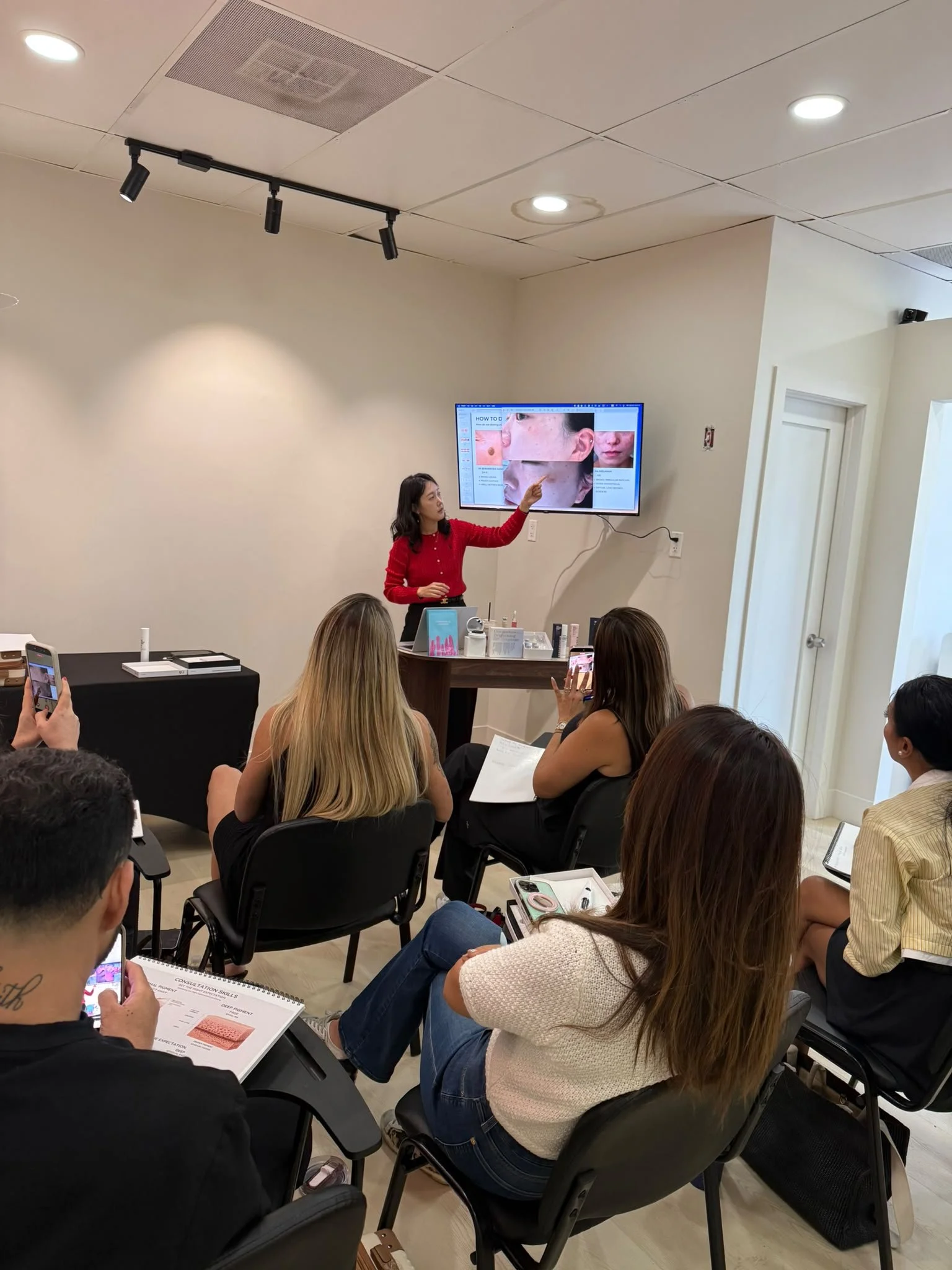 Ms Son Ji Hye teaching a classroom of beauty professionals