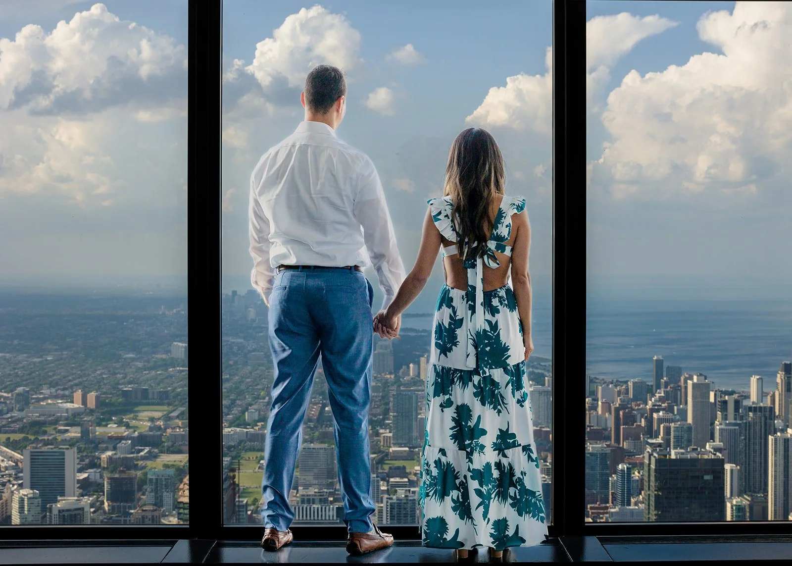 Surprise proposal at Willis Tower Skydeck with Chicago skyline at sunset — proposal photography by The Proposal Studios