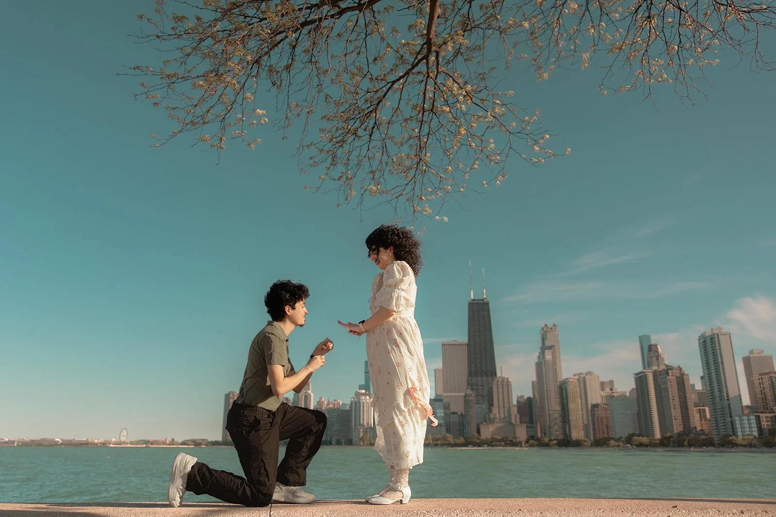 Couple approaching the proposal location at North Avenue Beach in Chicago, captured before the moment
