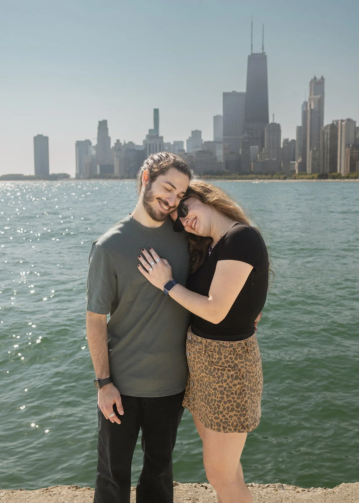 Romantic portrait at North Avenue Beach with sunset light reflecting off Lake Michigan — hand-edited proposal photography