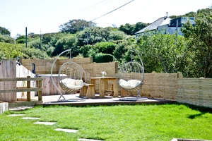 Rockpools garden and hanging chairs