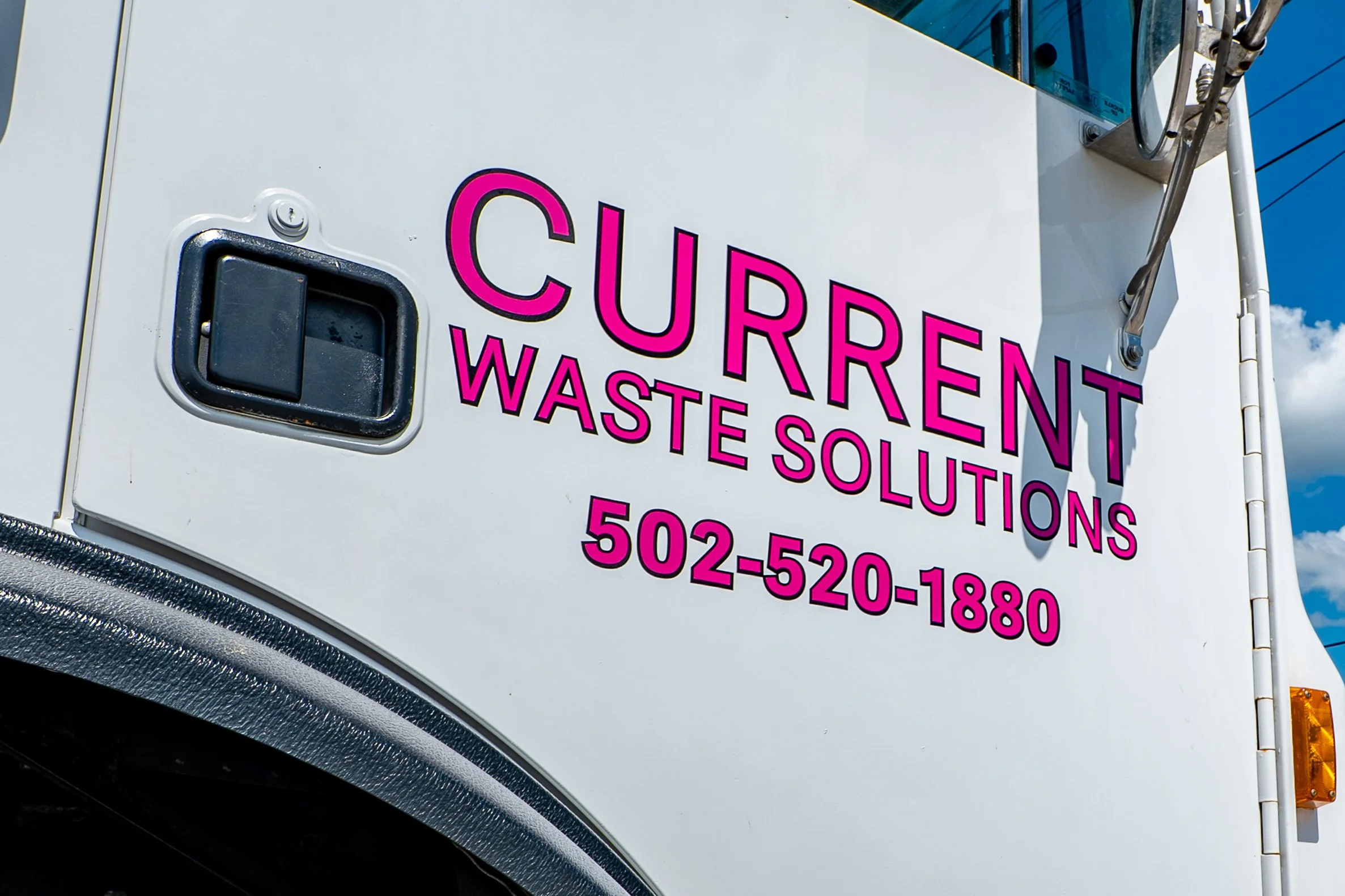 Current Waste Solutions truck with logo and phone number