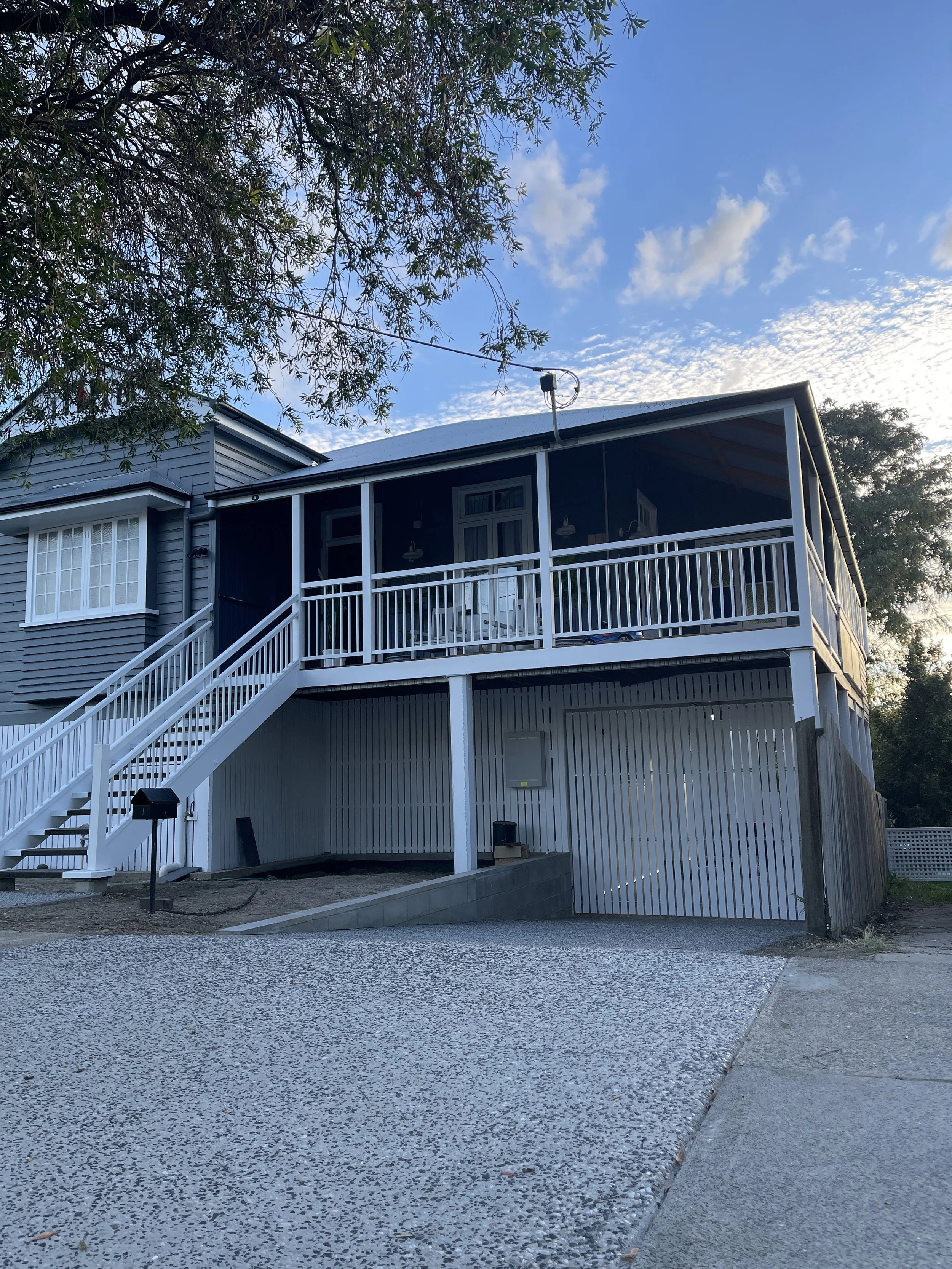 Freshly painted Queenslander with crisp weatherboards