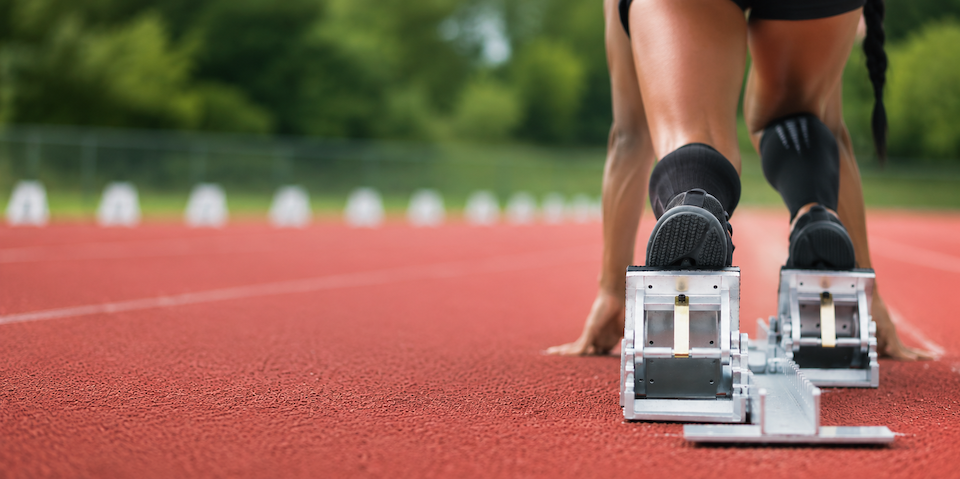 Runner in starting blocks