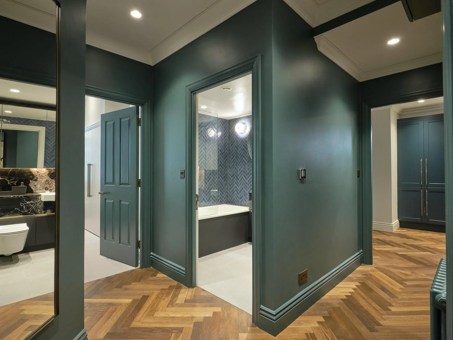 The bathroom, with brushed-brass fittings