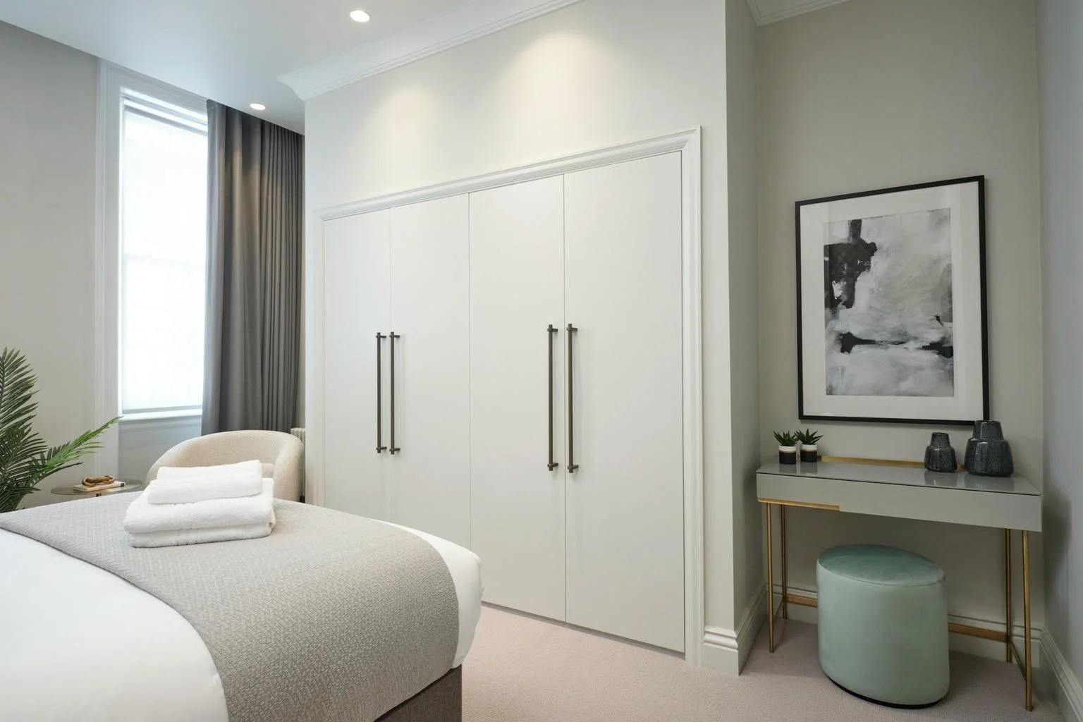 The bedroom, with built-in wardrobes