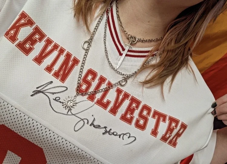 A Silvie wearing a signed Kevin Silvester jersey