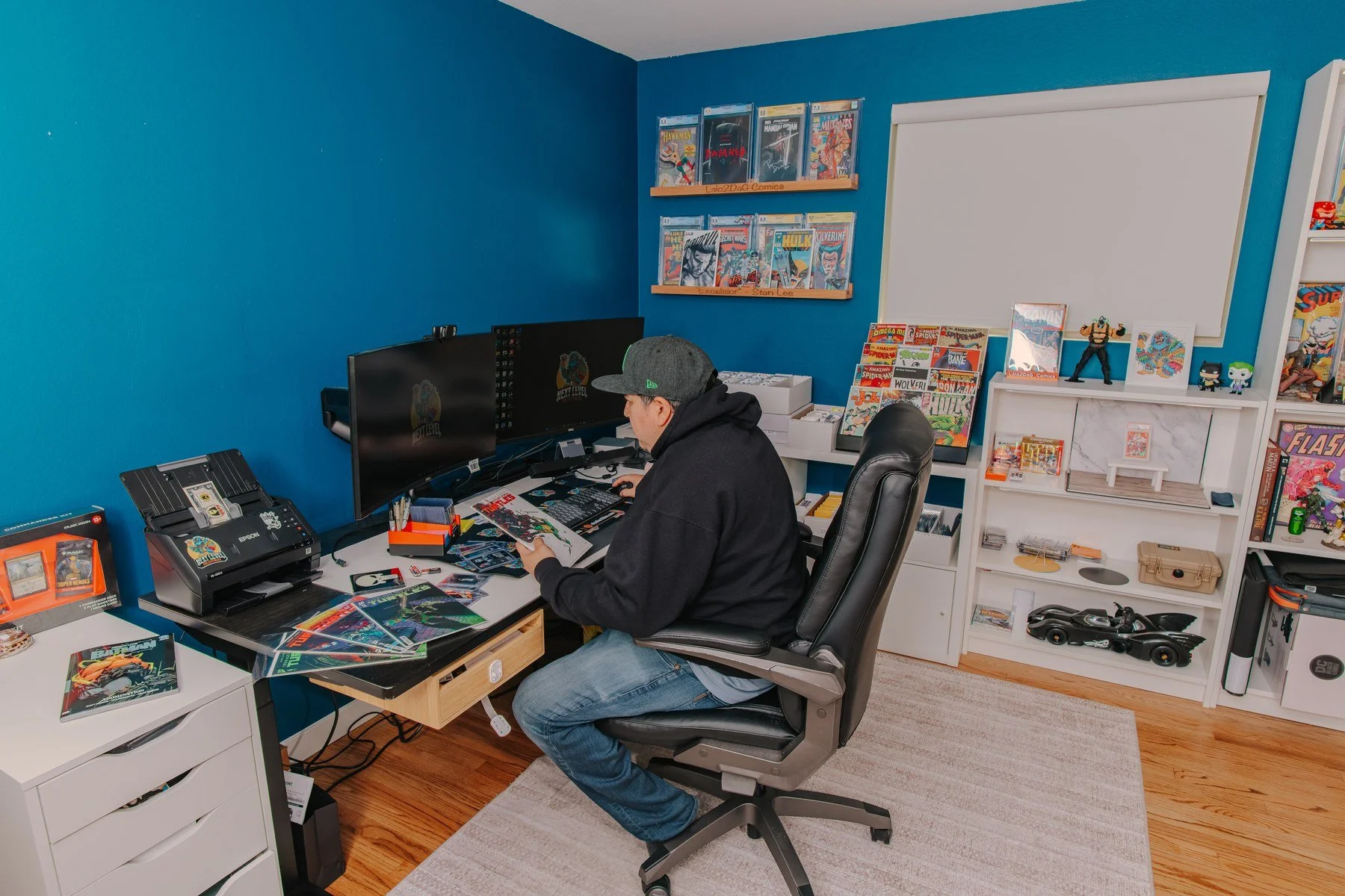 Next Level Collectibles owner researching and recording collectibles at the command center
