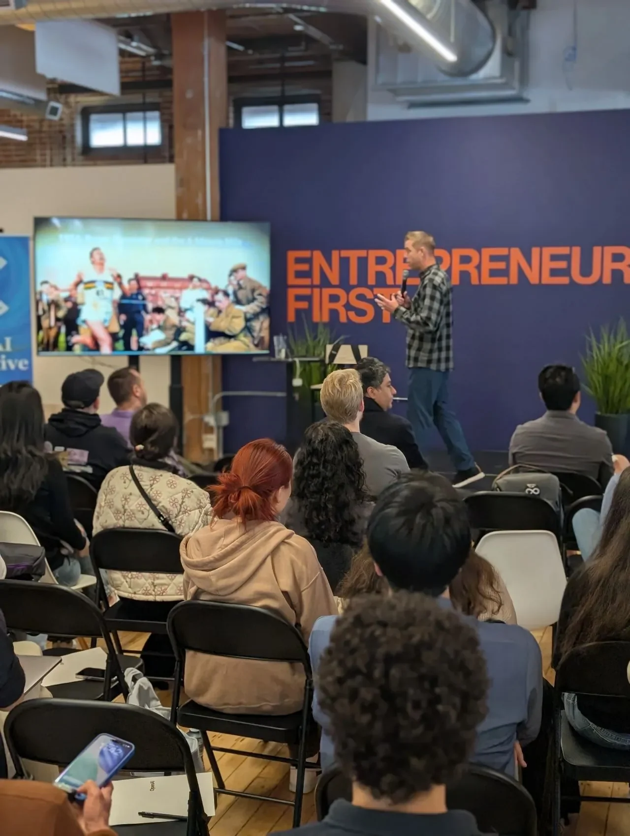 Speaker presenting to hackathon participants