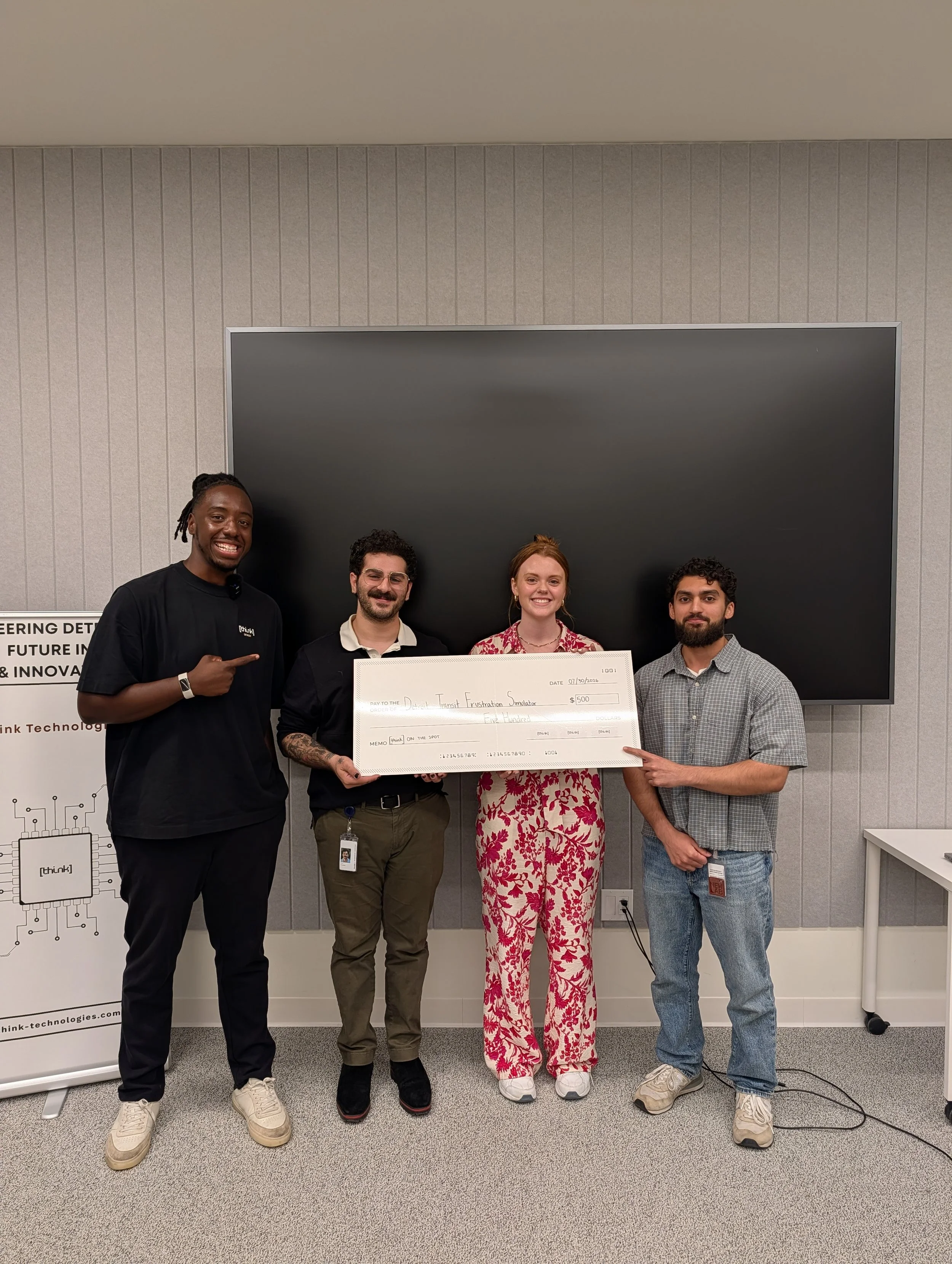 Think Technologies organizers and the winning hackathon team