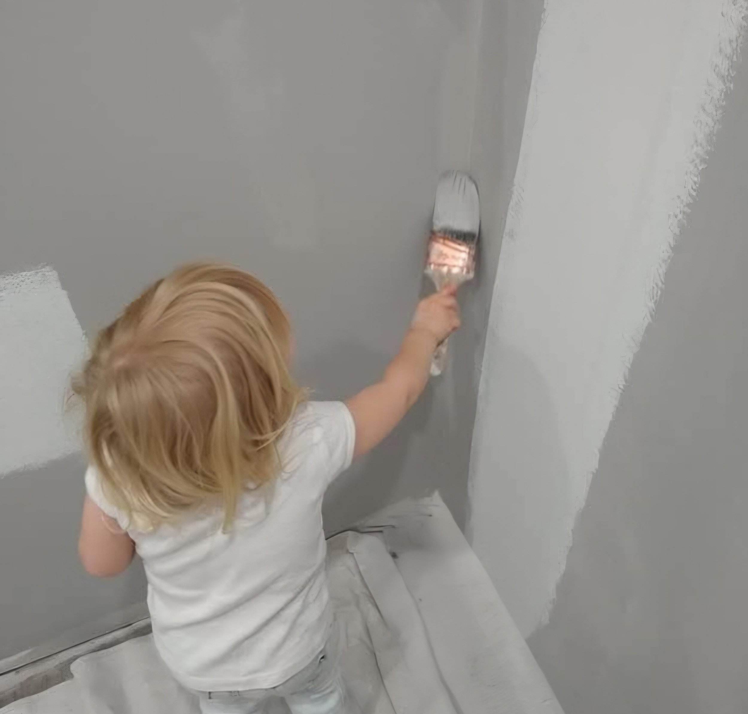 Daughter painting wall