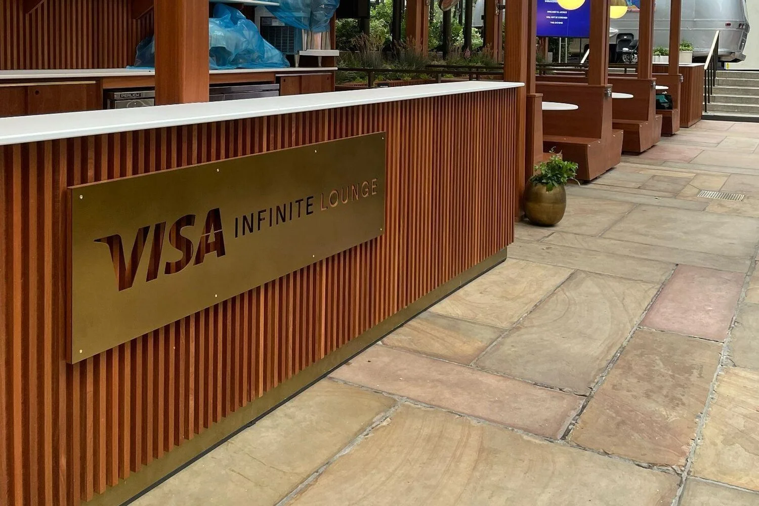 Visa Infinite Lounge millwork bar and pergola at 30 Rockefeller Center