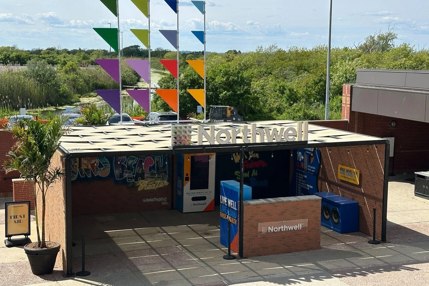 Northwell tent activation with coloured flag canopy at Jones Beach Theater
