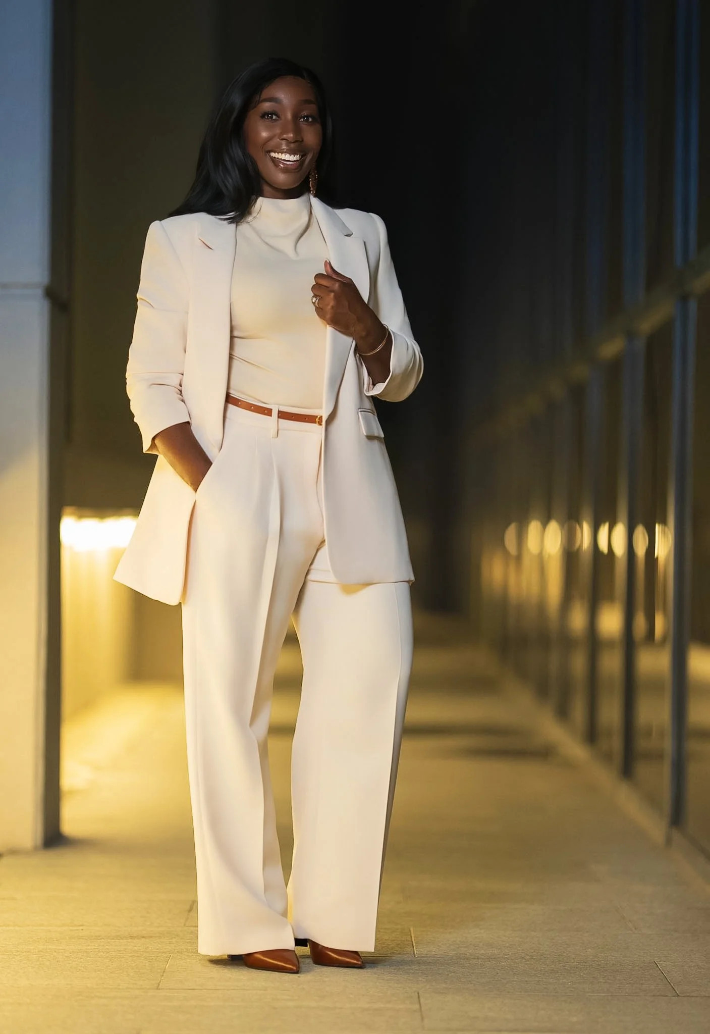 Alicia Hill in a cream-colored suit