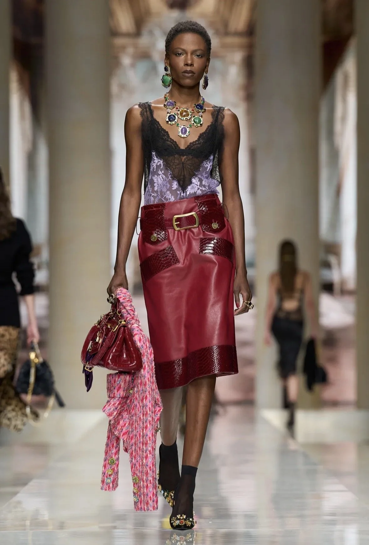 Red, purple lace and jewel-toned accessories.