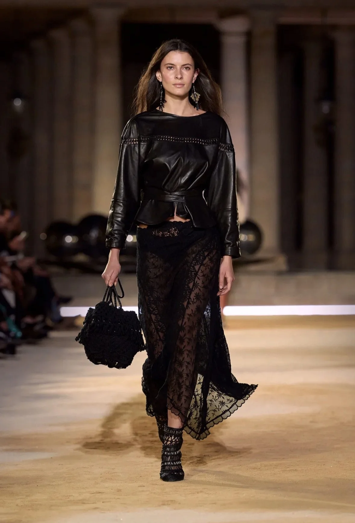 A defined waist and a sheer lace skirt.