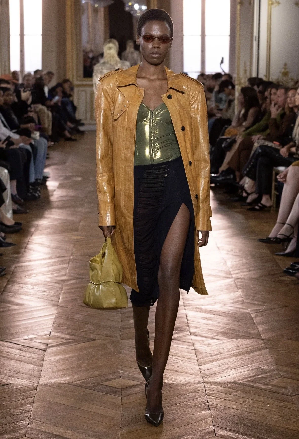 A mustard coat with an olive metallic top.