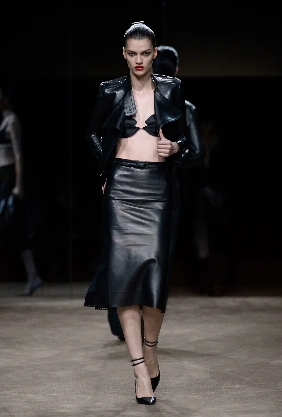 Tom Ford — cropped leather tailoring and a slim midi skirt.