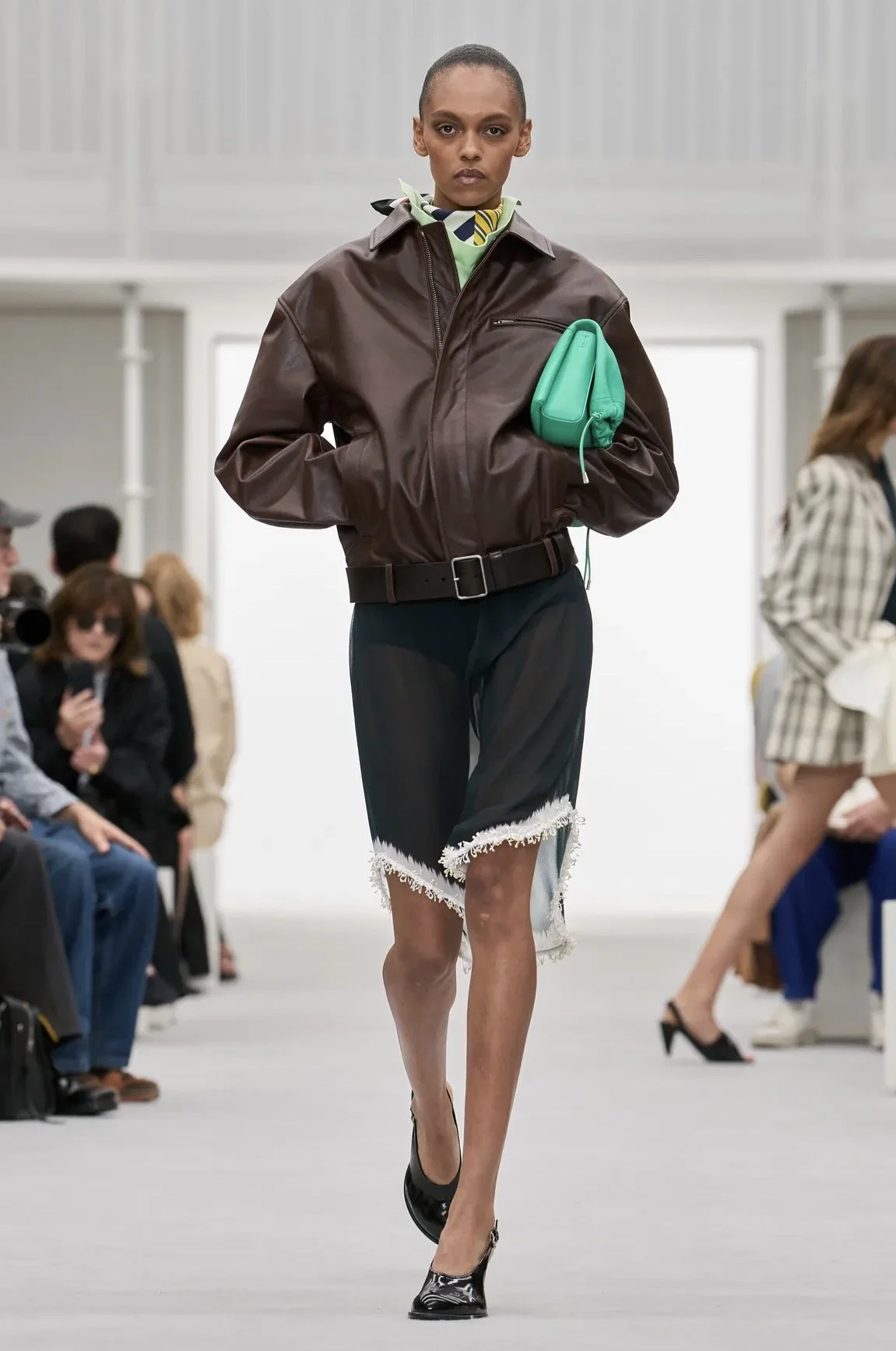 Chocolate brown, a bright green bag and a fringed hem.