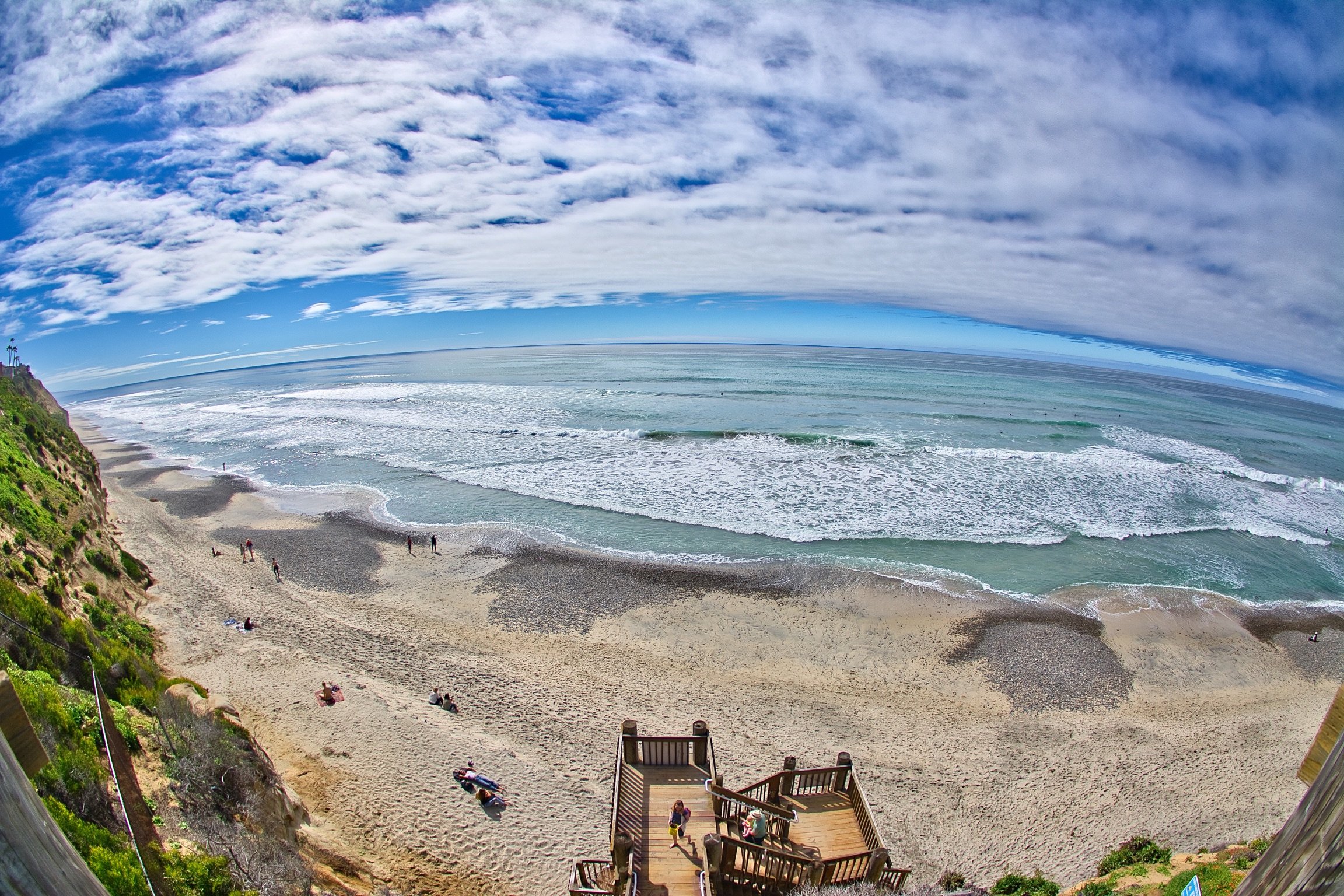 Aerial view of a beach stairway and coastline in Encinitas, San Diego County