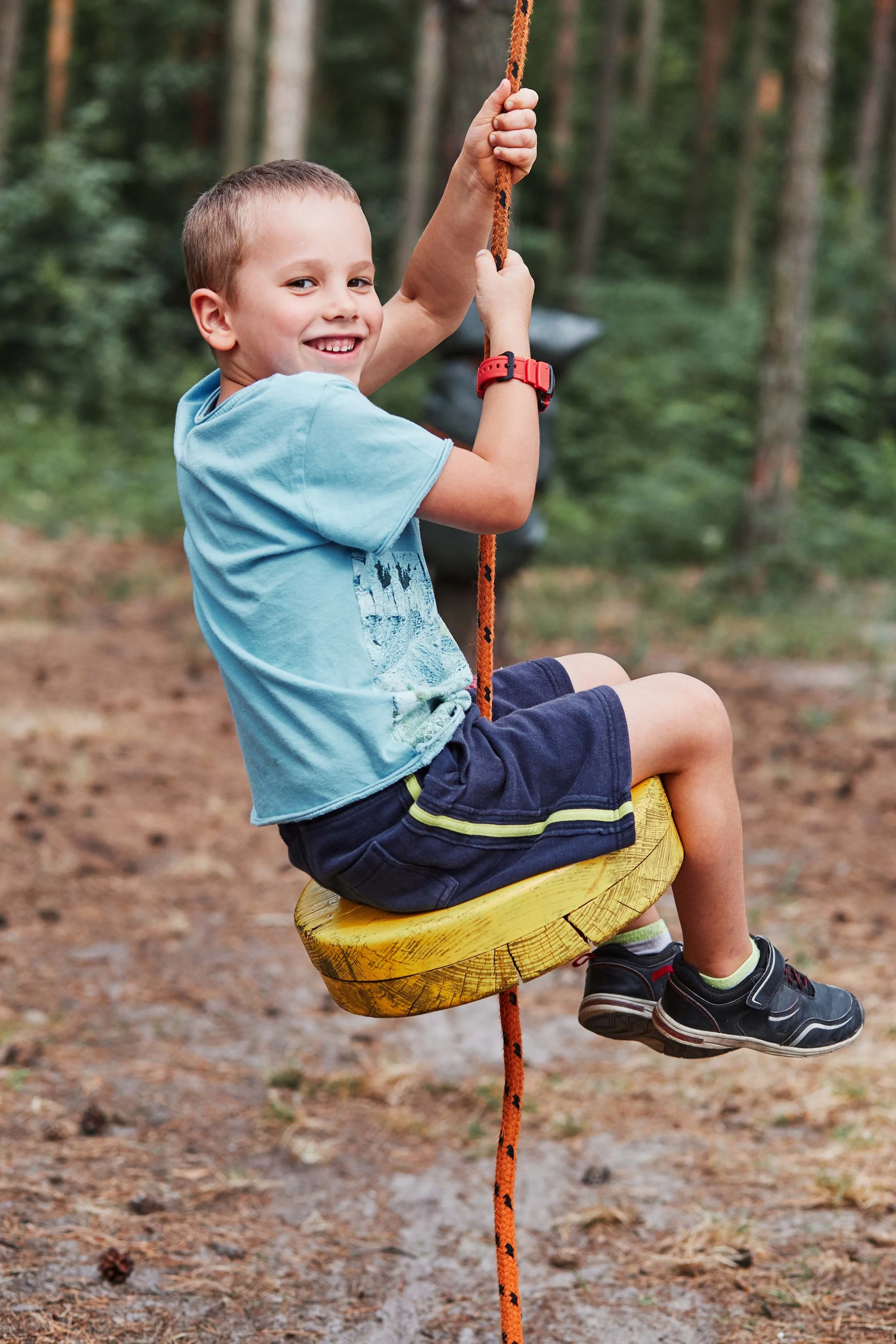 Smiling child on a swing