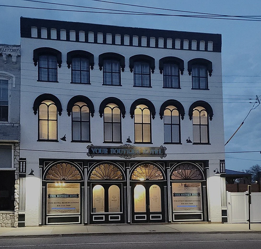 Your Boutique Hotel exterior at dusk