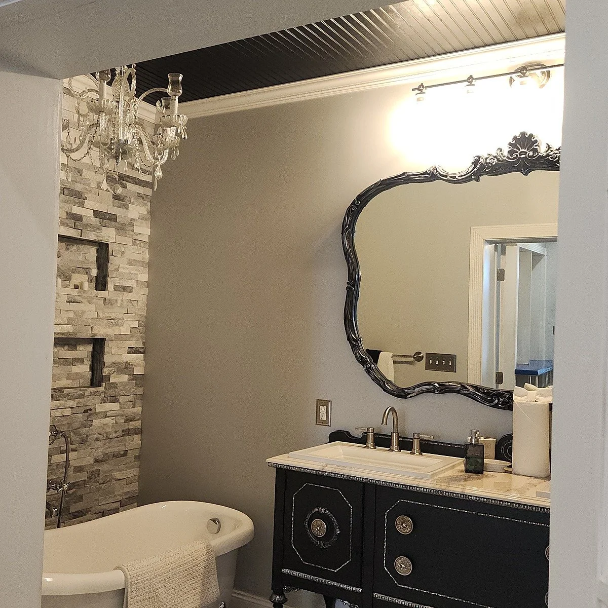 The master suite bathroom with a clawfoot soaking tub and double vanity