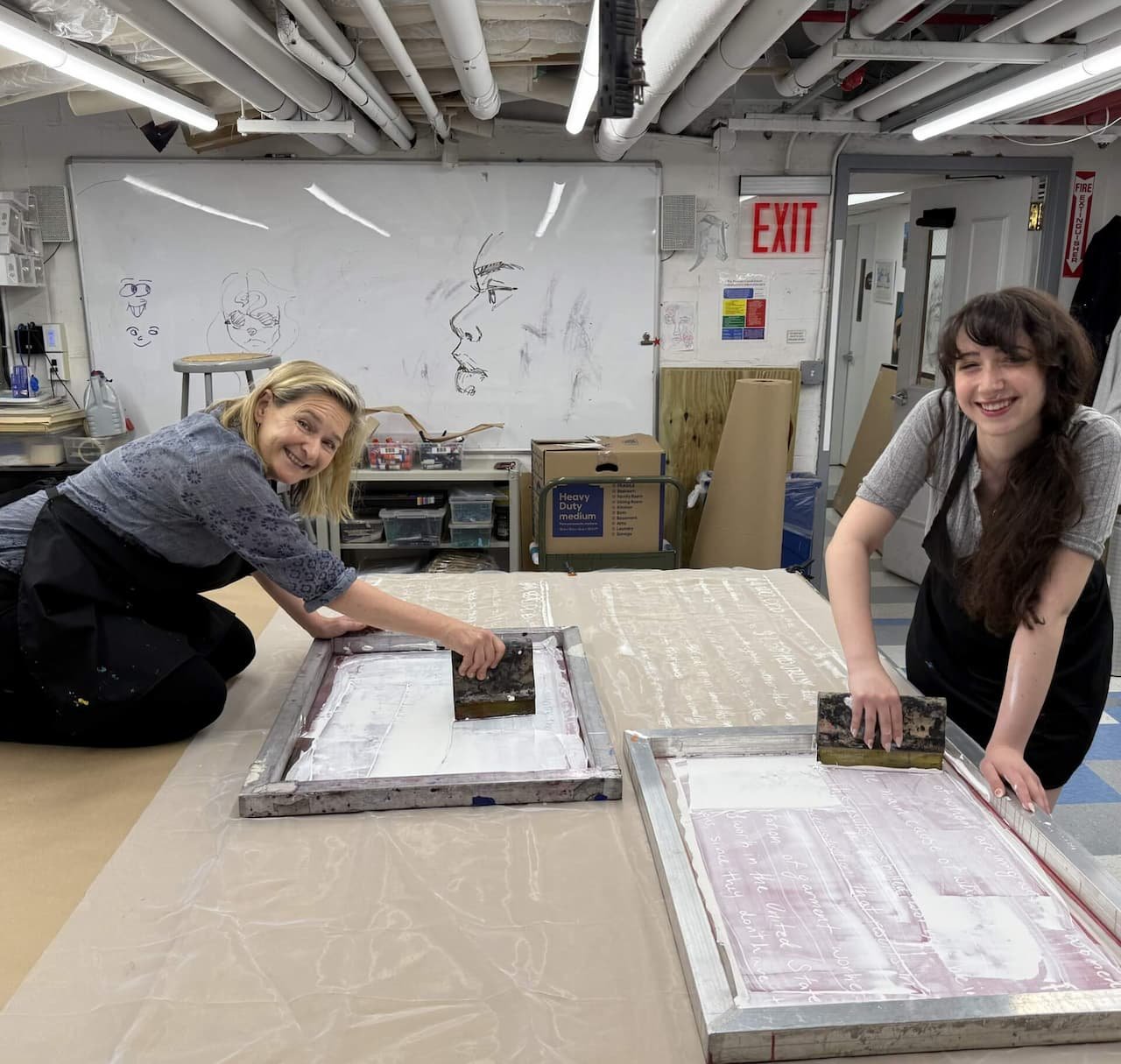 Dr. Nell Daniel guides art students in hands-on printmaking at her NYC studio. Professional portfolio coaching helps students master techniques for college applications.